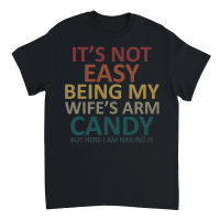 Product Its not easy being my wifes arm candy but here i am nailing it Unisex T-Shirt